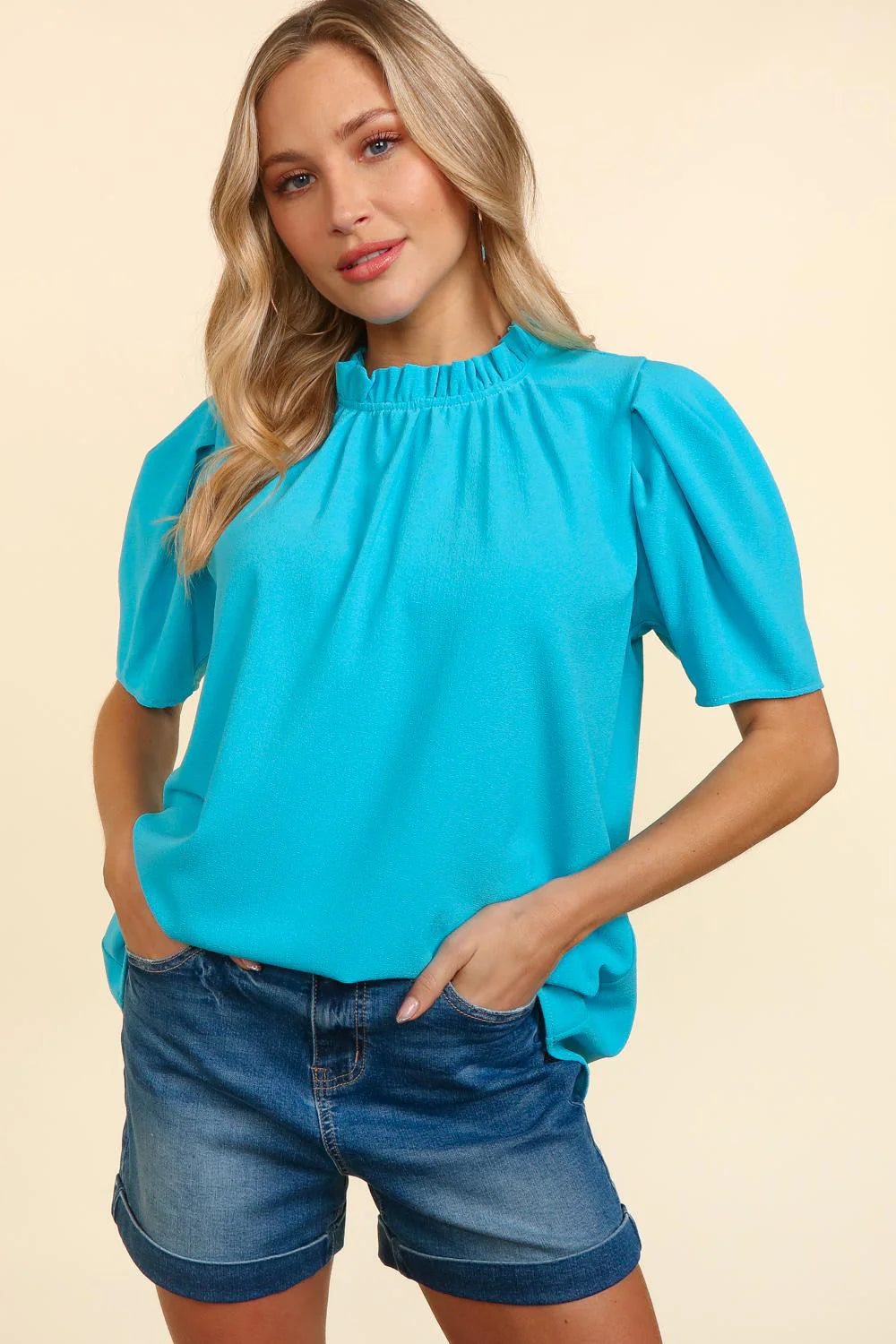 BLUE PLEATED WOVEN TOP WITH BACK NECK BUTTON